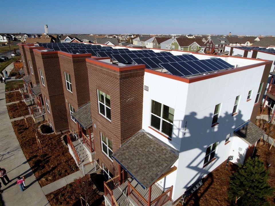 Tall homes with solar panels on the roofs