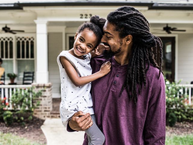 man holding little girl